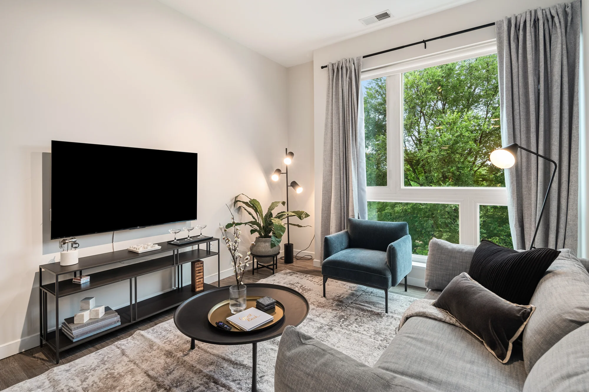 Living room with city view — Downtown at Yale