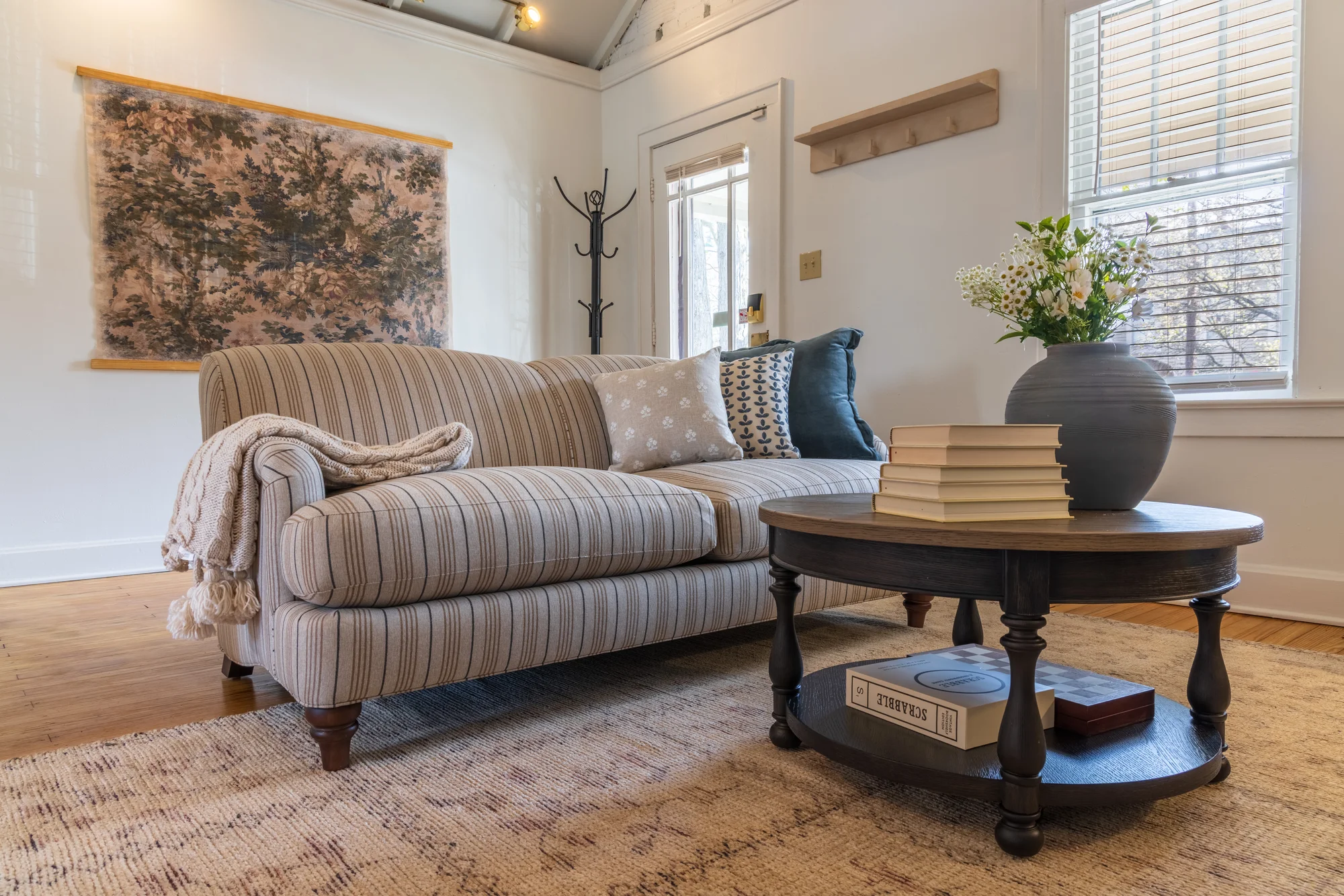 Living room with layered textiles — German Village Cottage