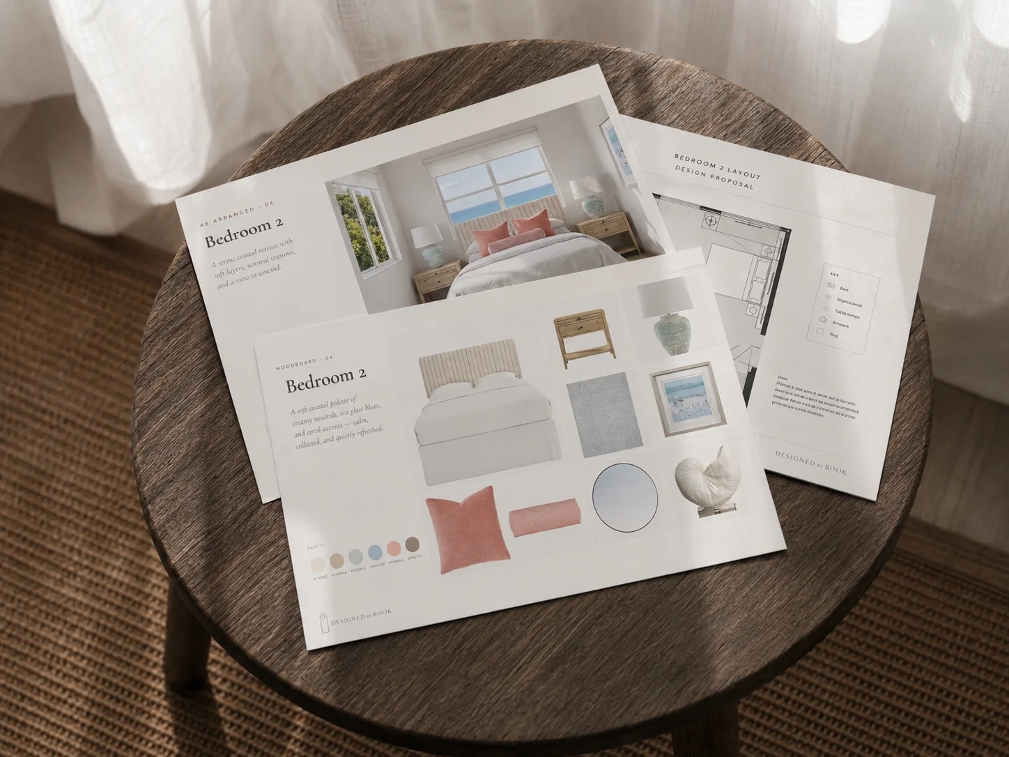 Designed to Book deliverables — moodboard, composed board and layout proposal printed and laid on a table