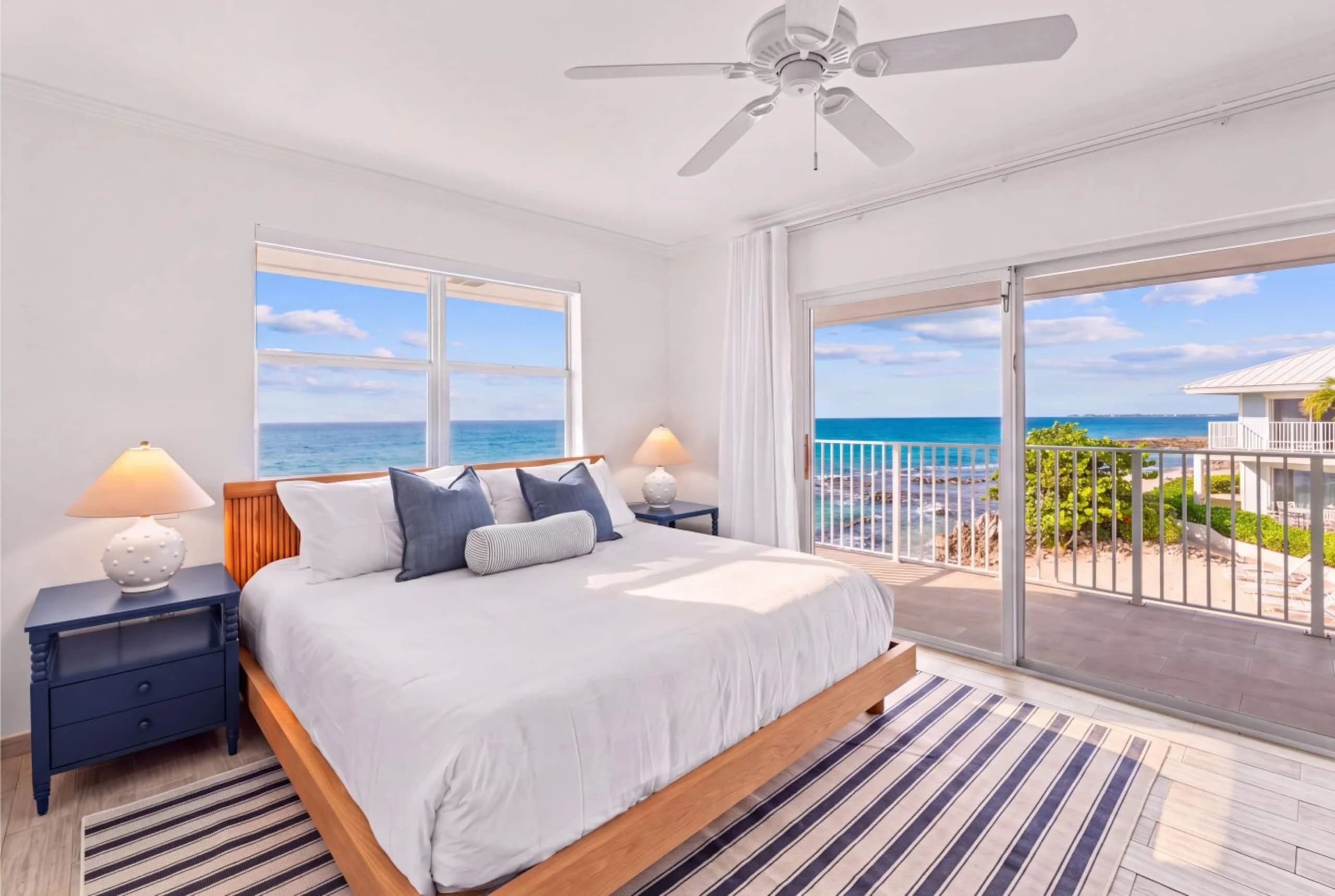 Ocean-view bedroom in Grand Cayman designed by Designed to Book